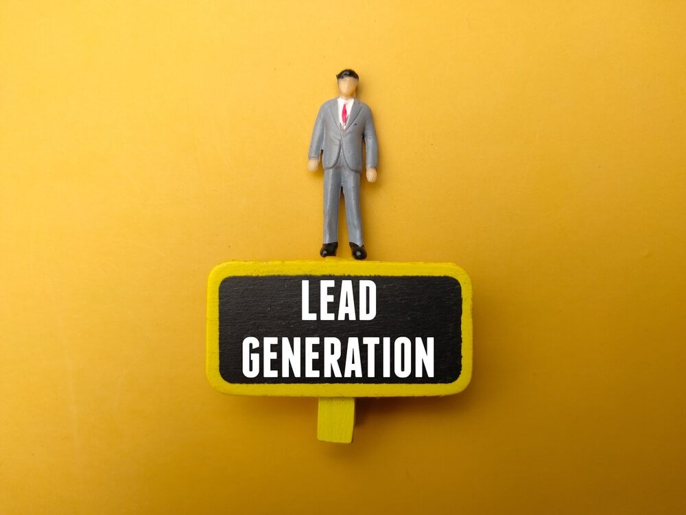 lead generation_Miniature people and wooden board with the word Lead Generation on yellow background.