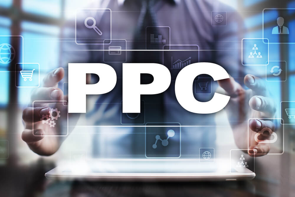 PPC_Businessman using tablet pc and selecting ppc.