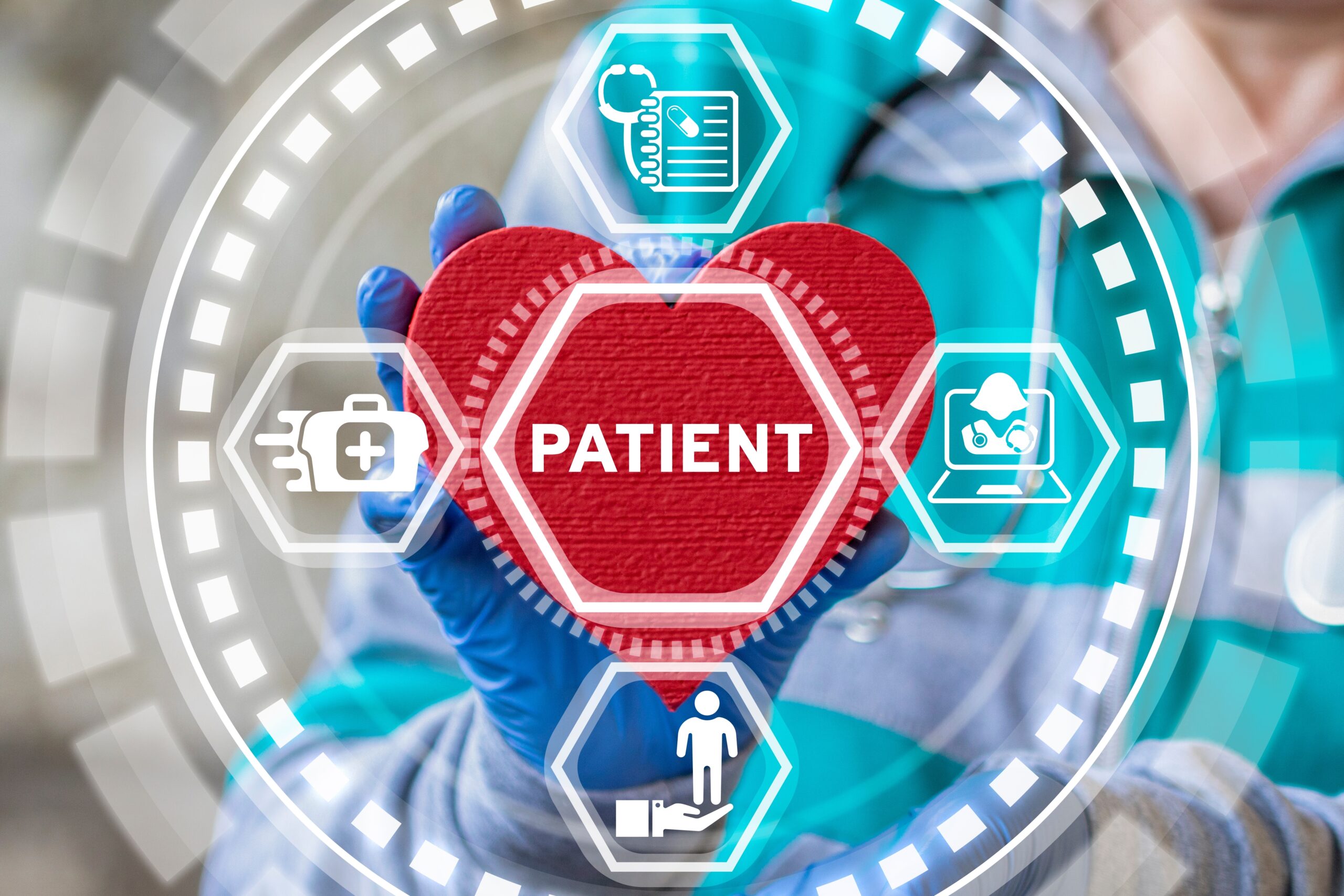 Doctor holds a red heart with the word "patient" up to a diagnostic screen to show patient-centric CMO strategies