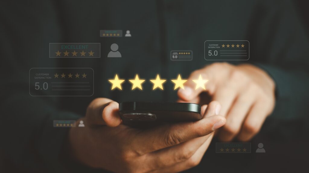 A man holds a phone, leaving a five-star review for a healthcare company, thanks to their patient-centric CMO strategies