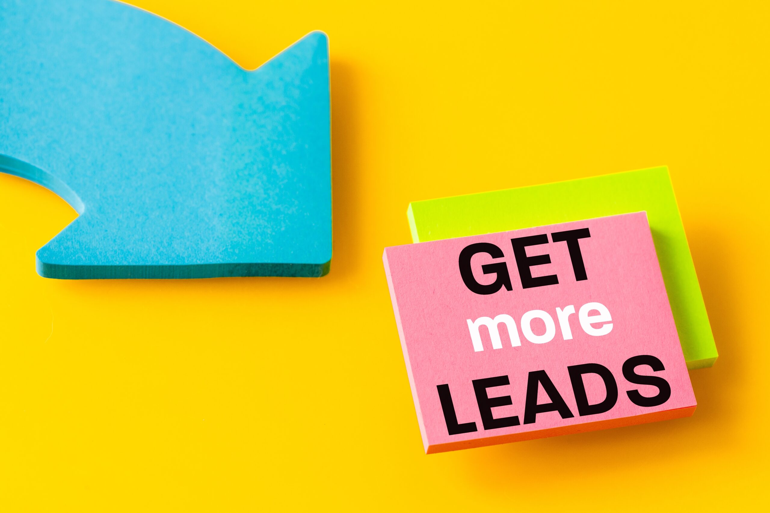 A blue arrow points to "Get more leads" on colorful sticky notes