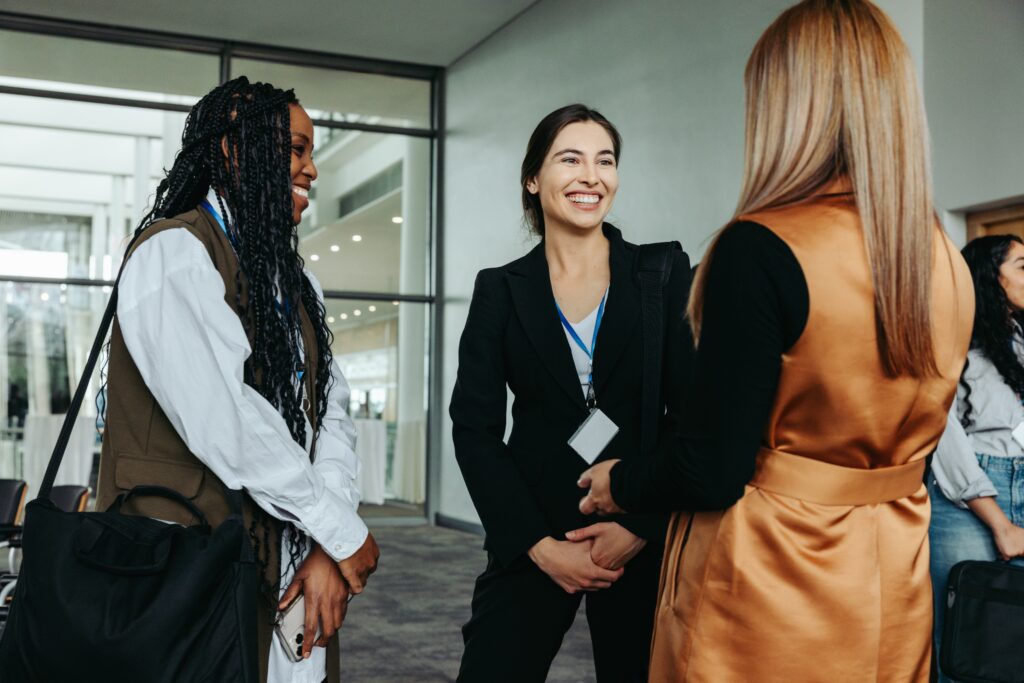 Three lawyers networking in an office building as part a civil litigation marketing technique